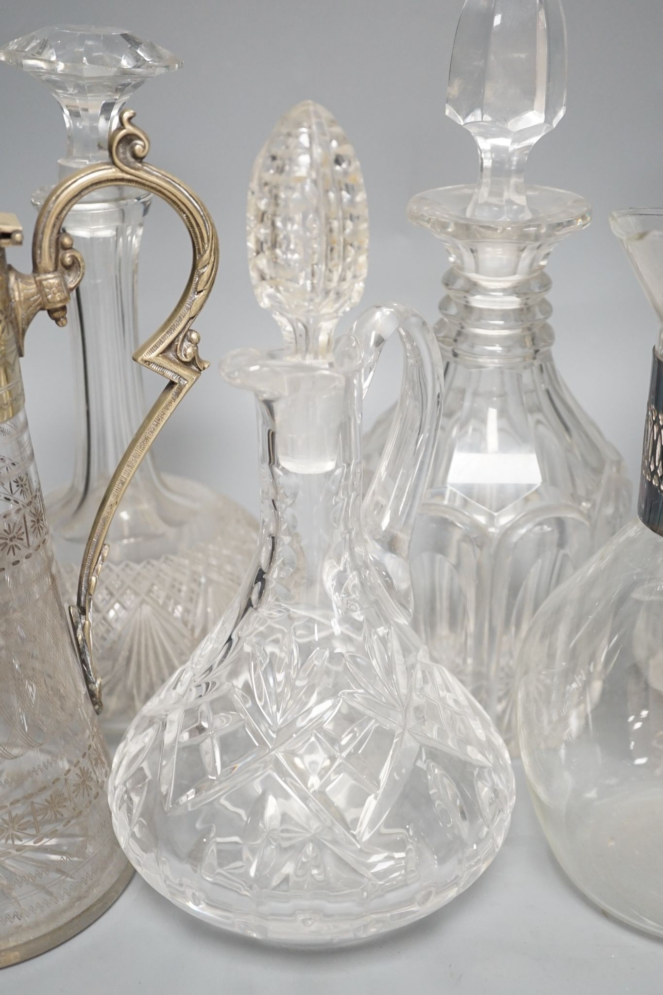 A Hukin and Heath claret jug and other decanters etc.